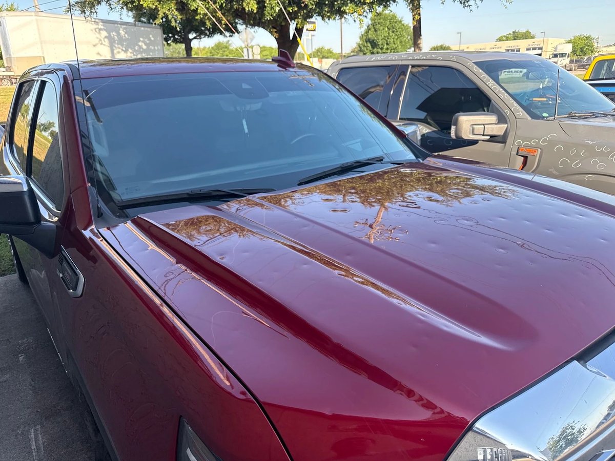 GMC Sierra Denali with hail damage before repair at DG Collision Center Lewisville TX