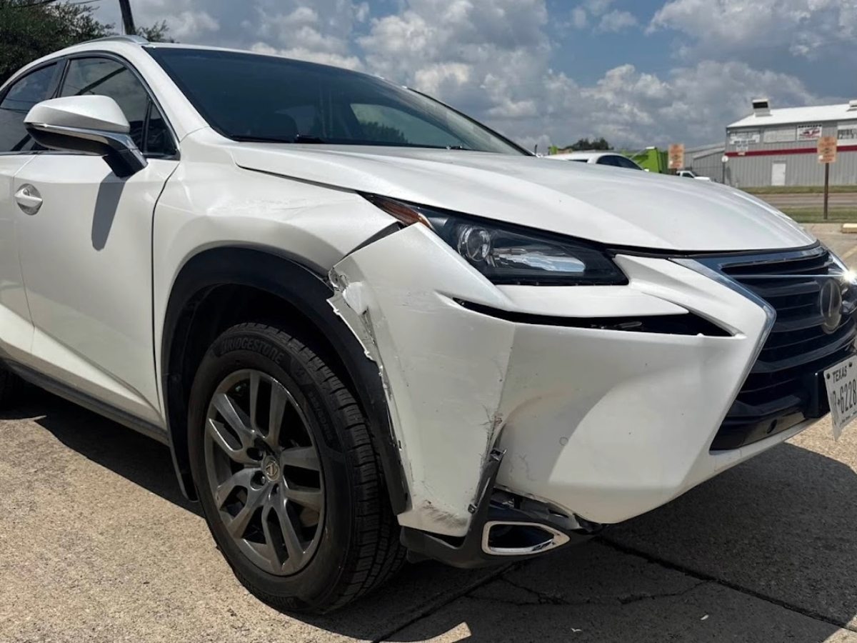 Customer's Lexus NX with front bumper and fender damage before repair at DG Collision Center in Lewisville, TX