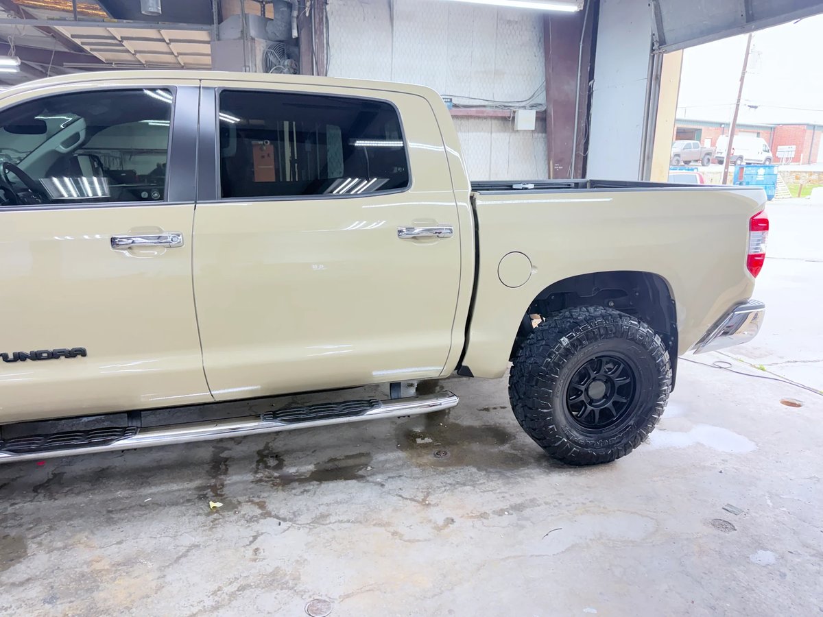 Toyota Tundra side impact repaired at DG Collision Center Lewisville TX — door and quarter restored to factory finish